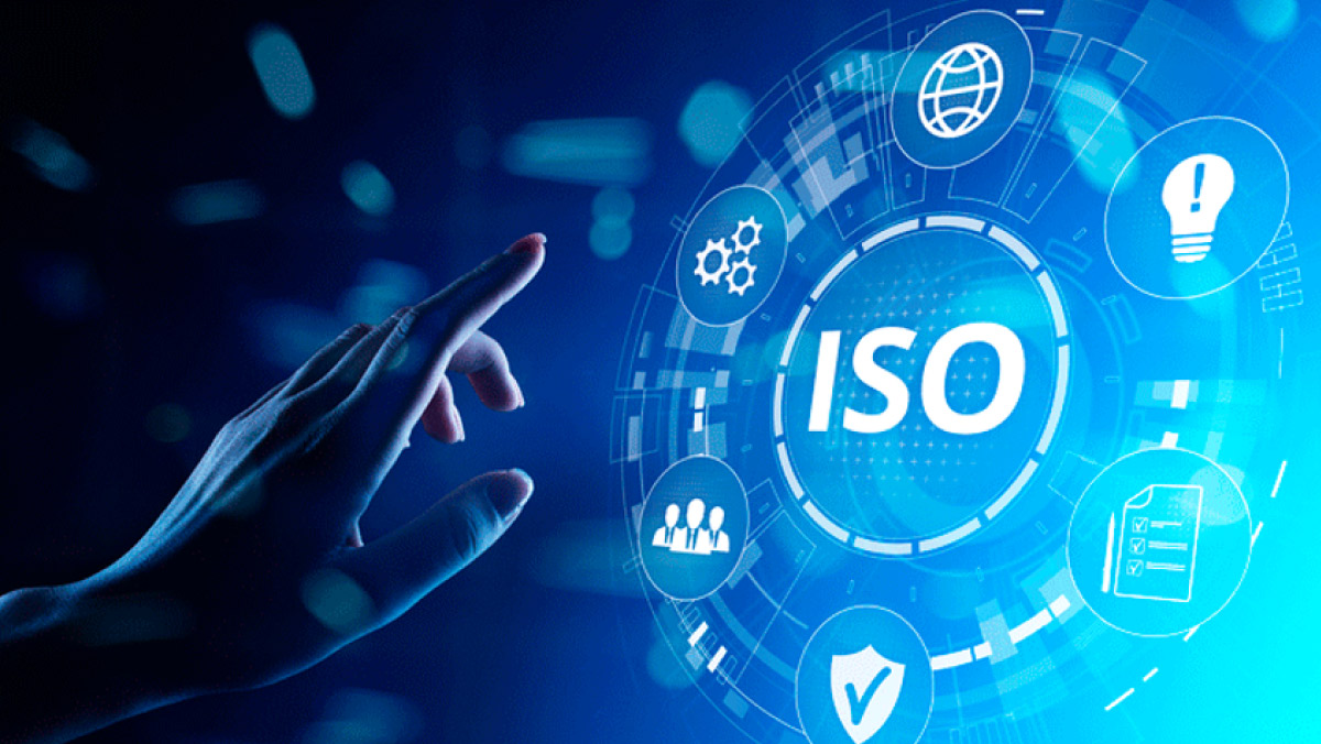 Hand reaching toward digital ISO interface symbolizing data-driven asset management