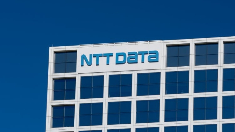 NTT DATA logo displayed on modern office building exterior